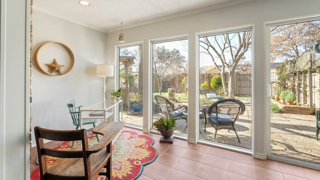 entryway featuring tile patterned flooring, ornamental molding, and a textured ceiling