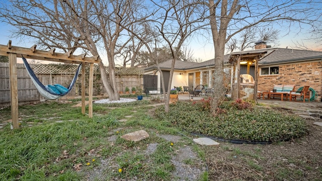 view of yard featuring a fenced backyard and a patio