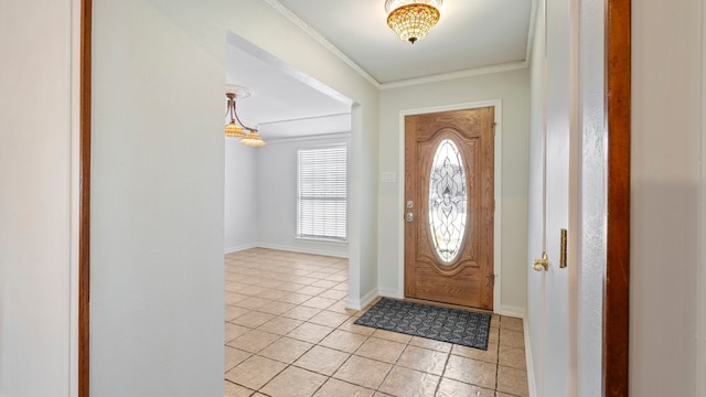 entryway featuring crown molding, baseboards, and light tile patterned floors