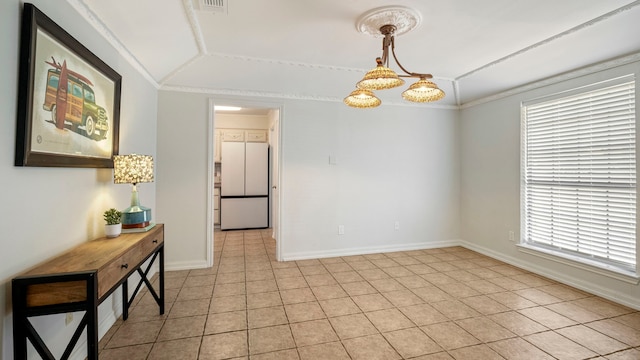 dining area featuring light tile patterned floors, visible vents, and baseboards