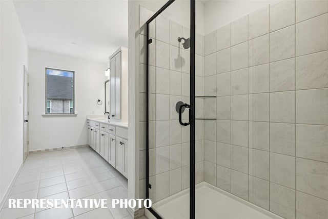 bathroom with tile patterned floors, a shower stall, baseboards, and double vanity