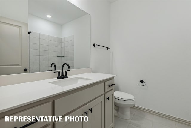 full bath featuring tile patterned flooring, vanity, and toilet