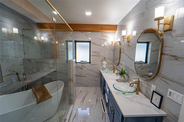 bathroom featuring double vanity, marble finish floor, a sink, a soaking tub, and a marble finish shower