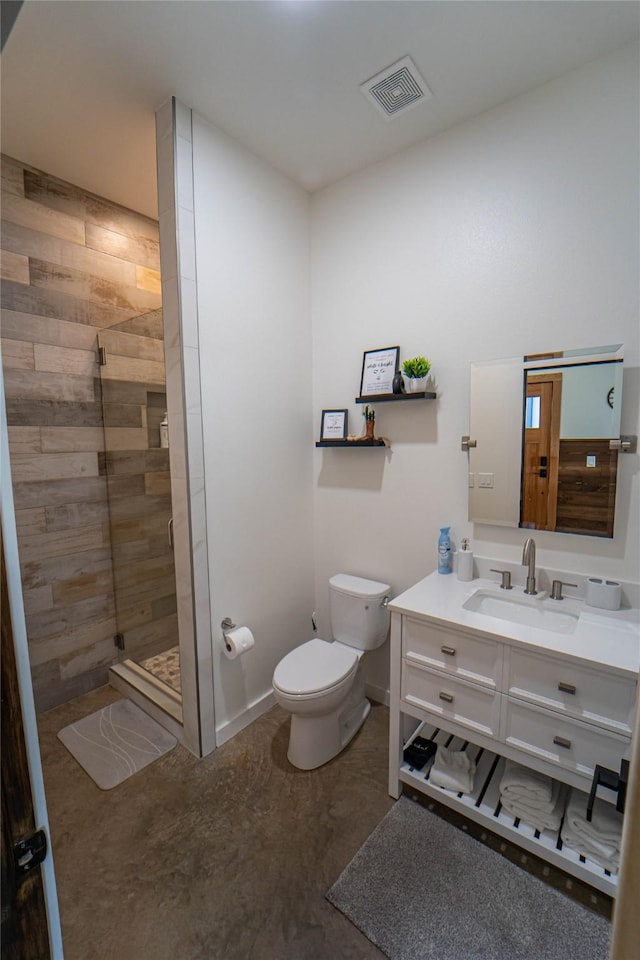 bathroom featuring a shower stall, visible vents, baseboards, toilet, and vanity