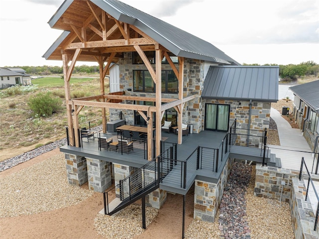 exterior space with metal roof and stone siding