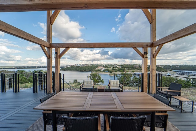wooden terrace featuring a water view