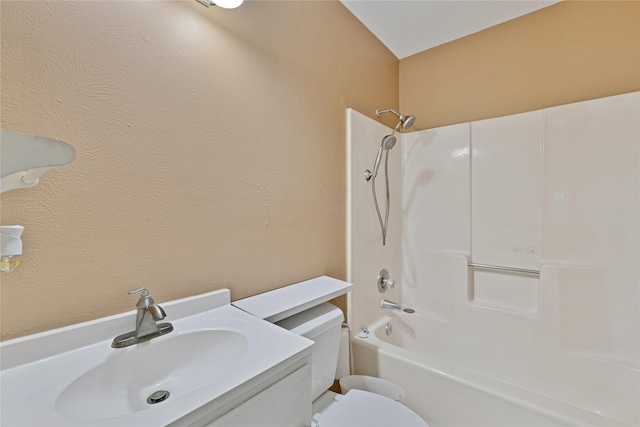 full bathroom with  shower combination, vanity, and toilet