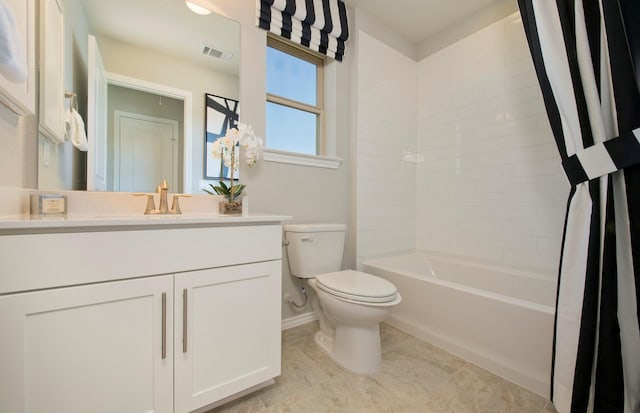 bathroom with toilet, vanity, visible vents, tile patterned floors, and shower / tub combo with curtain