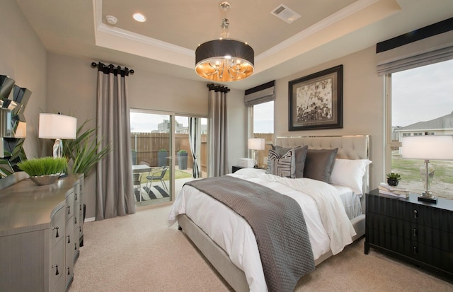 bedroom featuring access to exterior, crown molding, a raised ceiling, and light colored carpet