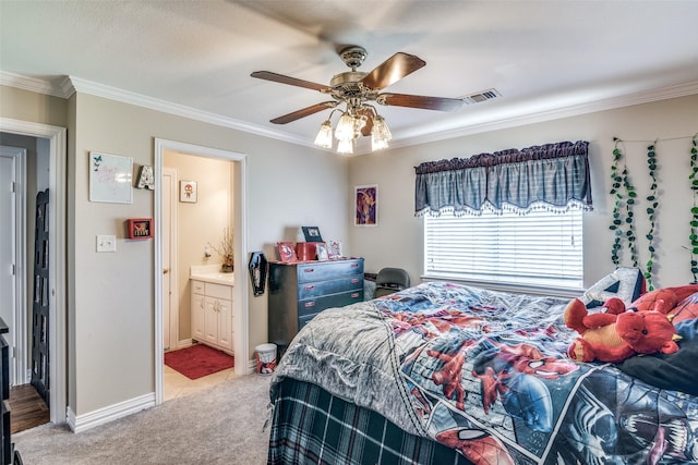 bedroom featuring baseboards, ensuite bathroom, light colored carpet, and crown molding