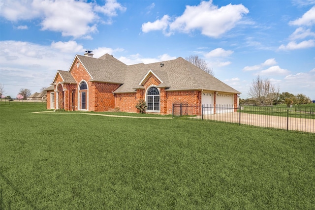 view of front of house featuring concrete driveway, brick siding, fence, and a front lawn