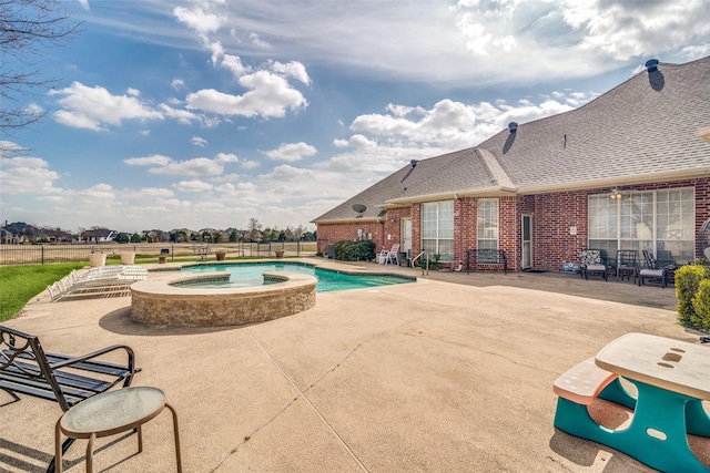 view of pool with a fenced in pool, a patio area, fence, and an in ground hot tub