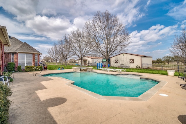 view of swimming pool with a patio, an outdoor structure, fence, and a pool with connected hot tub