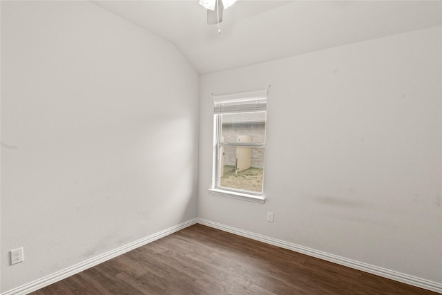 spare room featuring a ceiling fan, lofted ceiling, baseboards, and wood finished floors