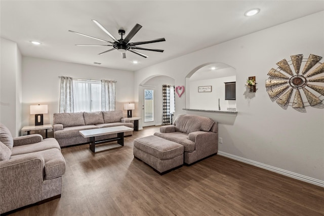 living area with dark wood-style floors, baseboards, a ceiling fan, and recessed lighting