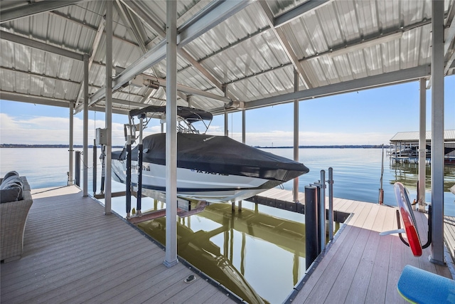 view of dock featuring a water view and boat lift