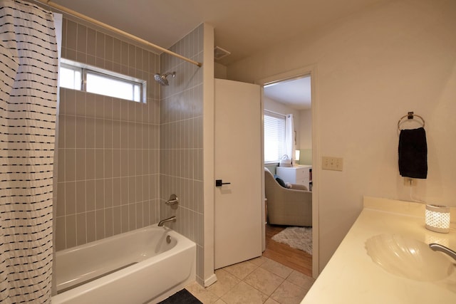 full bath with shower / bathtub combination with curtain, tile patterned flooring, and vanity