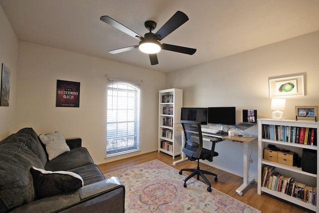 office area featuring a ceiling fan and wood finished floors