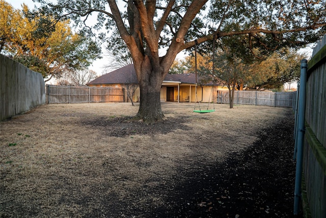 view of yard with a fenced backyard