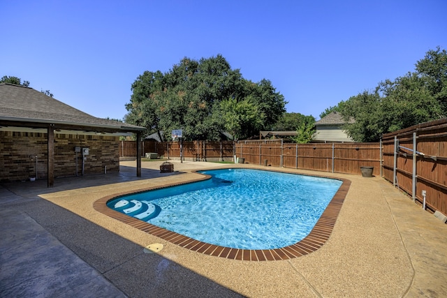 view of pool featuring a patio area, a fenced backyard, and a fenced in pool