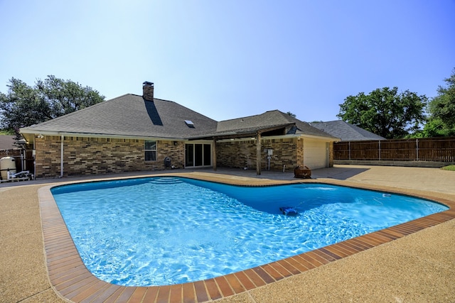 view of pool featuring a fenced in pool, fence, and a patio