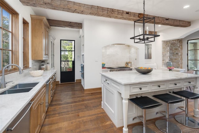 kitchen featuring dark wood-type flooring, a sink, beam ceiling, light stone countertops, and dishwasher