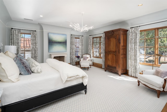 bedroom with a chandelier, recessed lighting, light colored carpet, visible vents, and baseboards