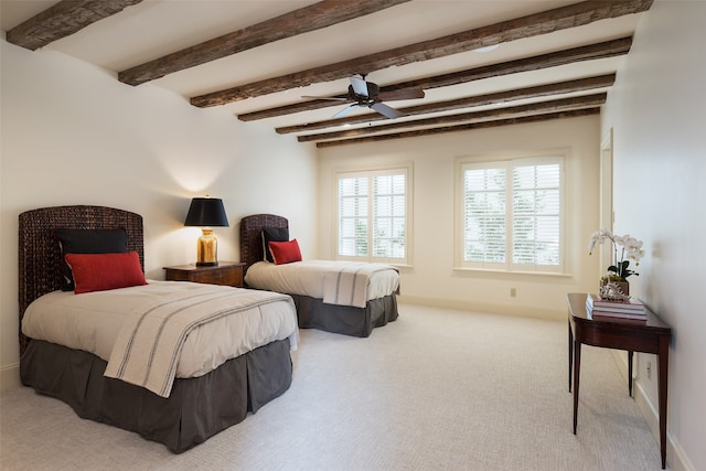 bedroom featuring carpet flooring, beamed ceiling, baseboards, and ceiling fan