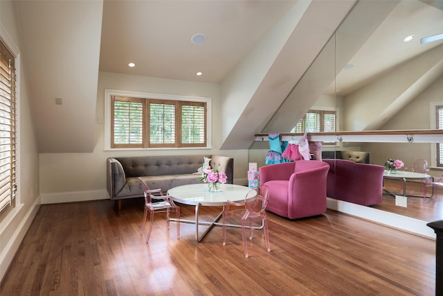 living area featuring recessed lighting, baseboards, and wood finished floors