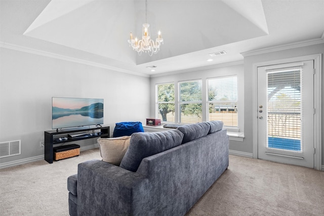 living room with light carpet, a tray ceiling, and visible vents