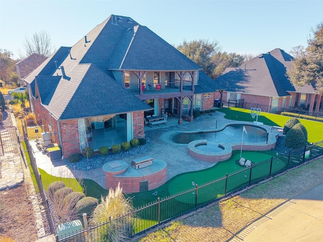 view of swimming pool featuring an in ground hot tub, a patio, a fenced backyard, and a fenced in pool