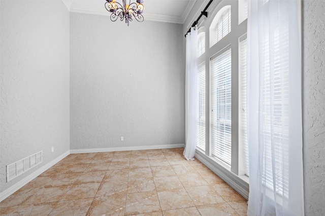 empty room featuring an inviting chandelier, a textured wall, visible vents, and ornamental molding