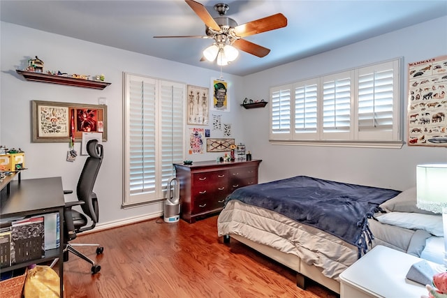 bedroom with wood finished floors and a ceiling fan