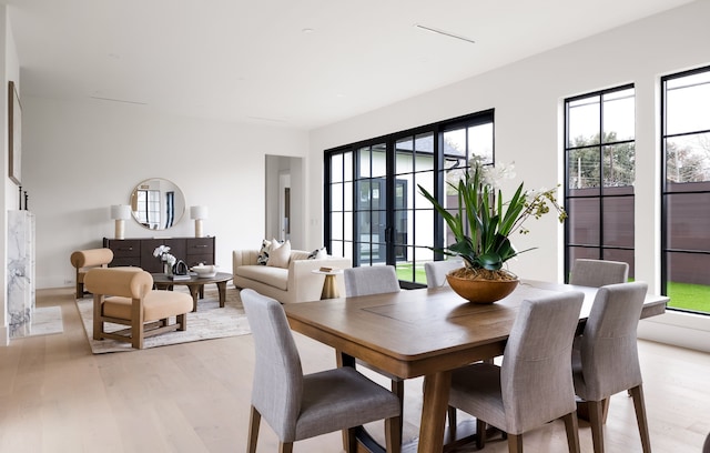 dining space with light wood-type flooring