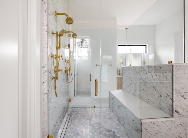 bathroom featuring a marble finish shower and tile patterned floors