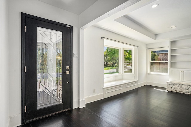 foyer entrance featuring dark wood-type flooring, baseboards, and recessed lighting