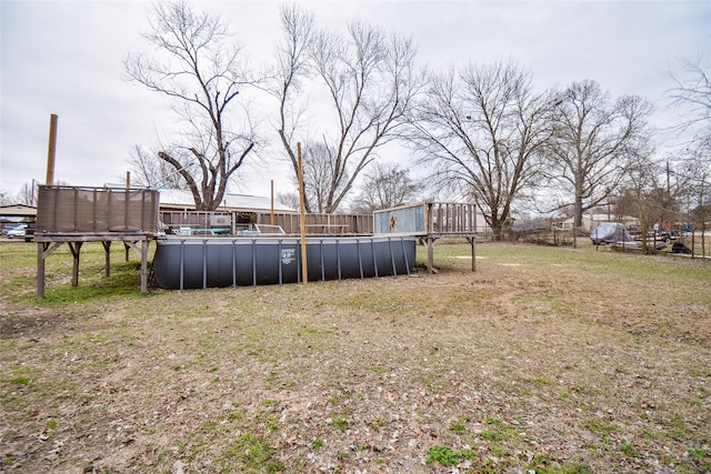 view of yard with an outdoor pool