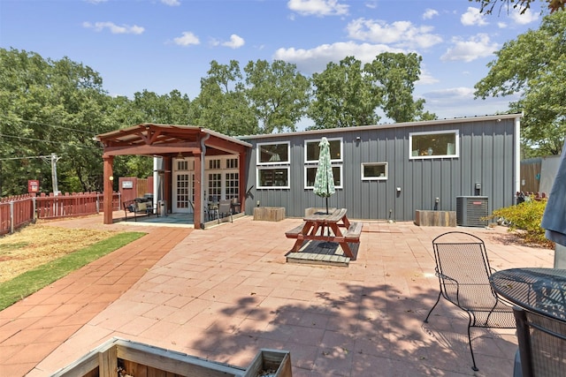 view of patio featuring french doors, fence, and central air condition unit