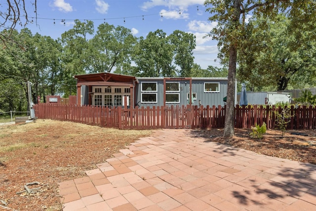 view of front of house featuring a fenced front yard and board and batten siding