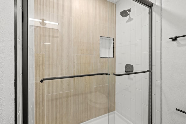 bathroom featuring a stall shower