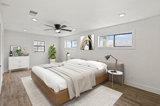 bedroom with baseboards, visible vents, a ceiling fan, light wood-style floors, and recessed lighting