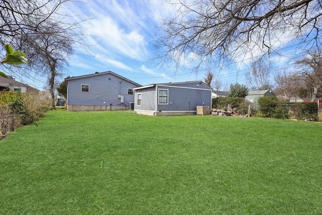 view of yard with fence and cooling unit