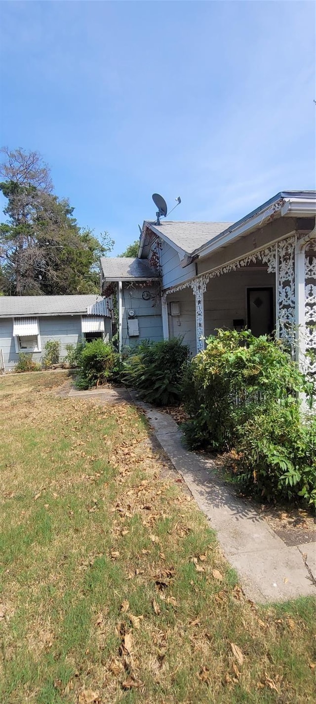 view of home's exterior featuring a yard