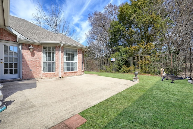 view of yard with a patio and fence