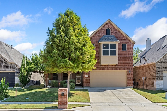 view of front of house featuring a garage, a front yard, concrete driveway, and brick siding