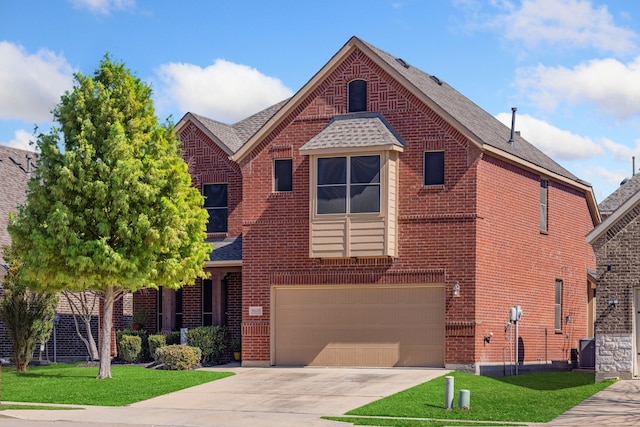 view of front of house with driveway, brick siding, and a front yard