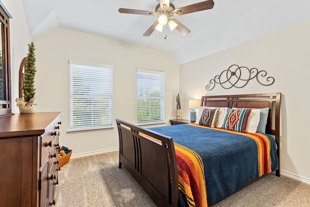 bedroom featuring lofted ceiling, ceiling fan, carpet flooring, and baseboards