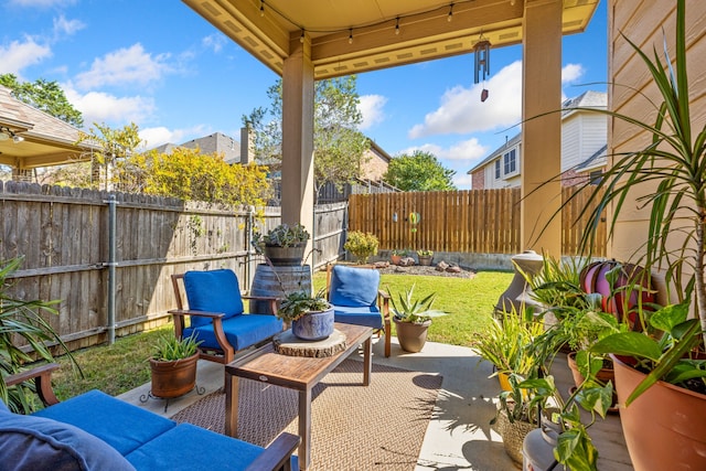 view of patio / terrace featuring an outdoor hangout area and a fenced backyard