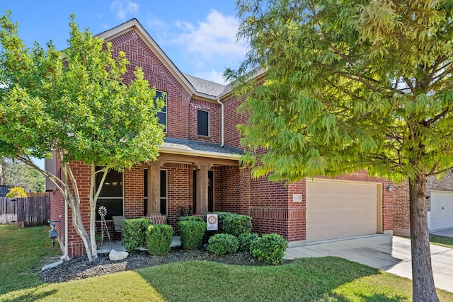 traditional home with covered porch, concrete driveway, brick siding, and a front lawn