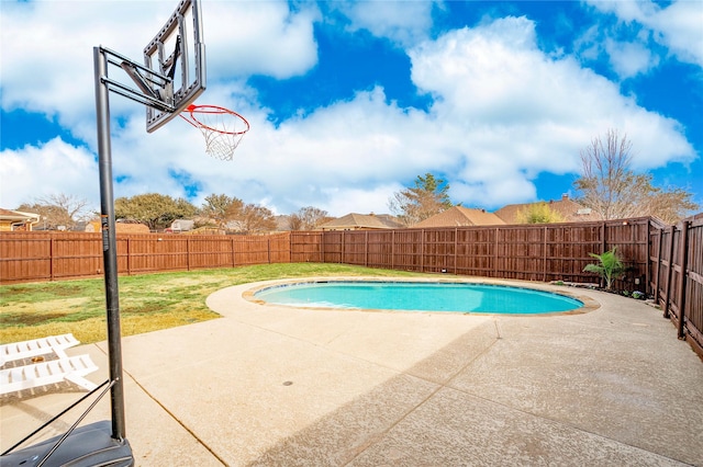 view of pool featuring a patio area, a fenced backyard, a fenced in pool, and a yard